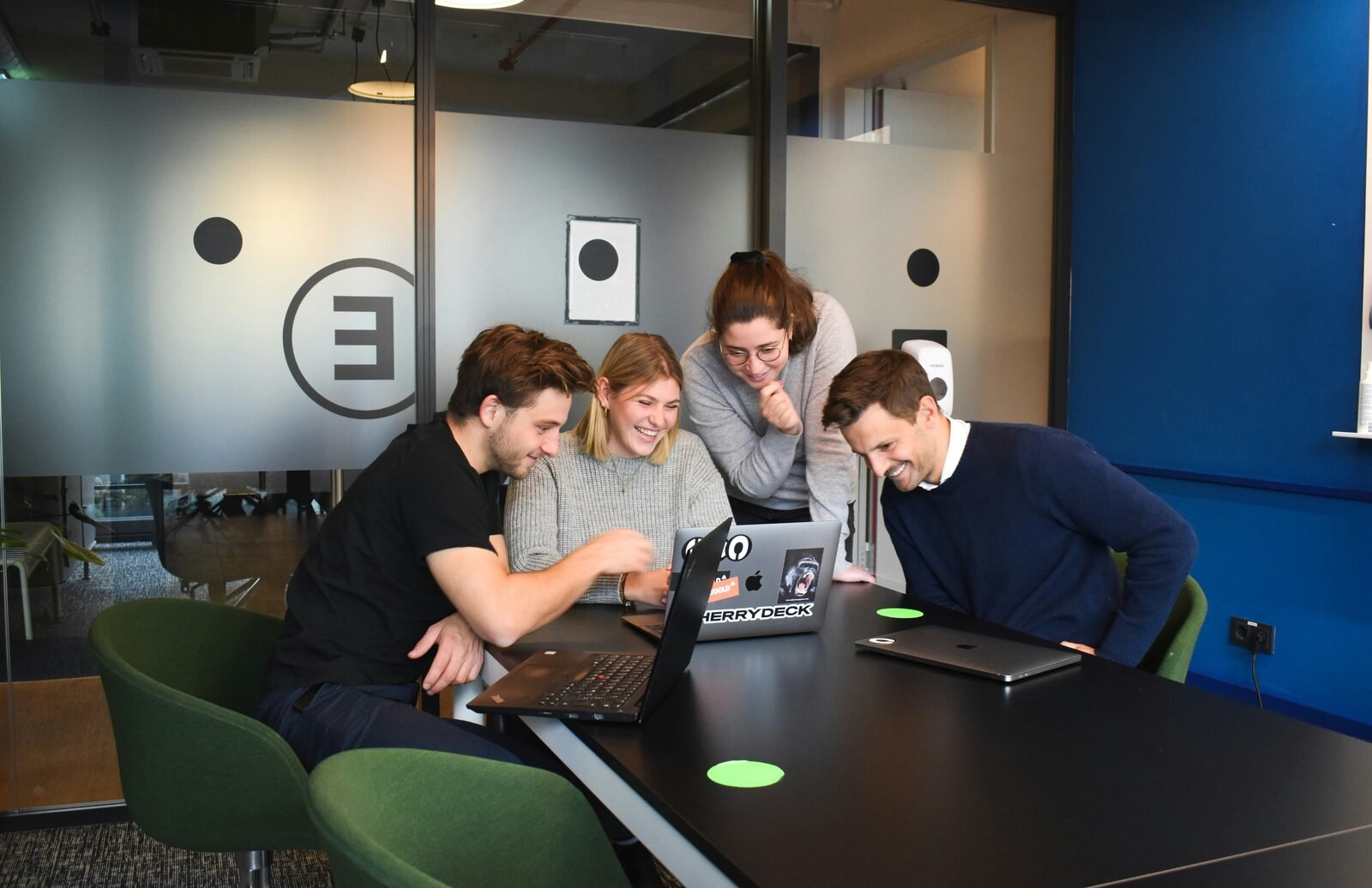 Assigned team reviewing work together at an office desk