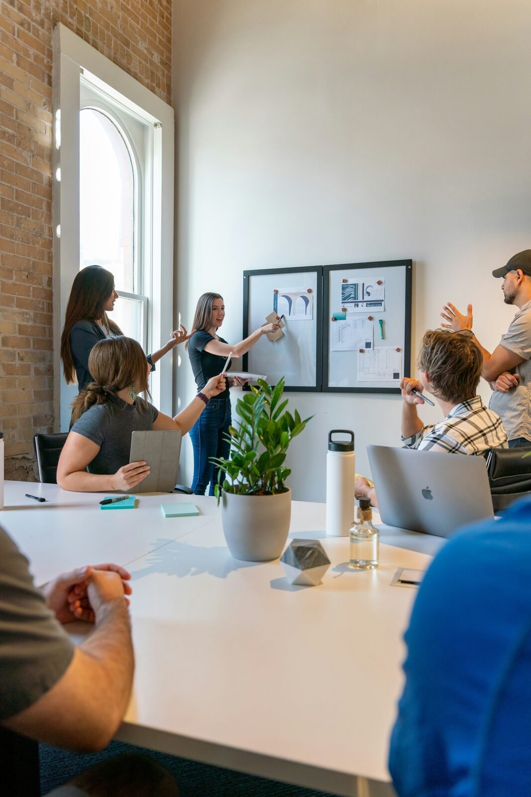 Team planning around a whiteboard